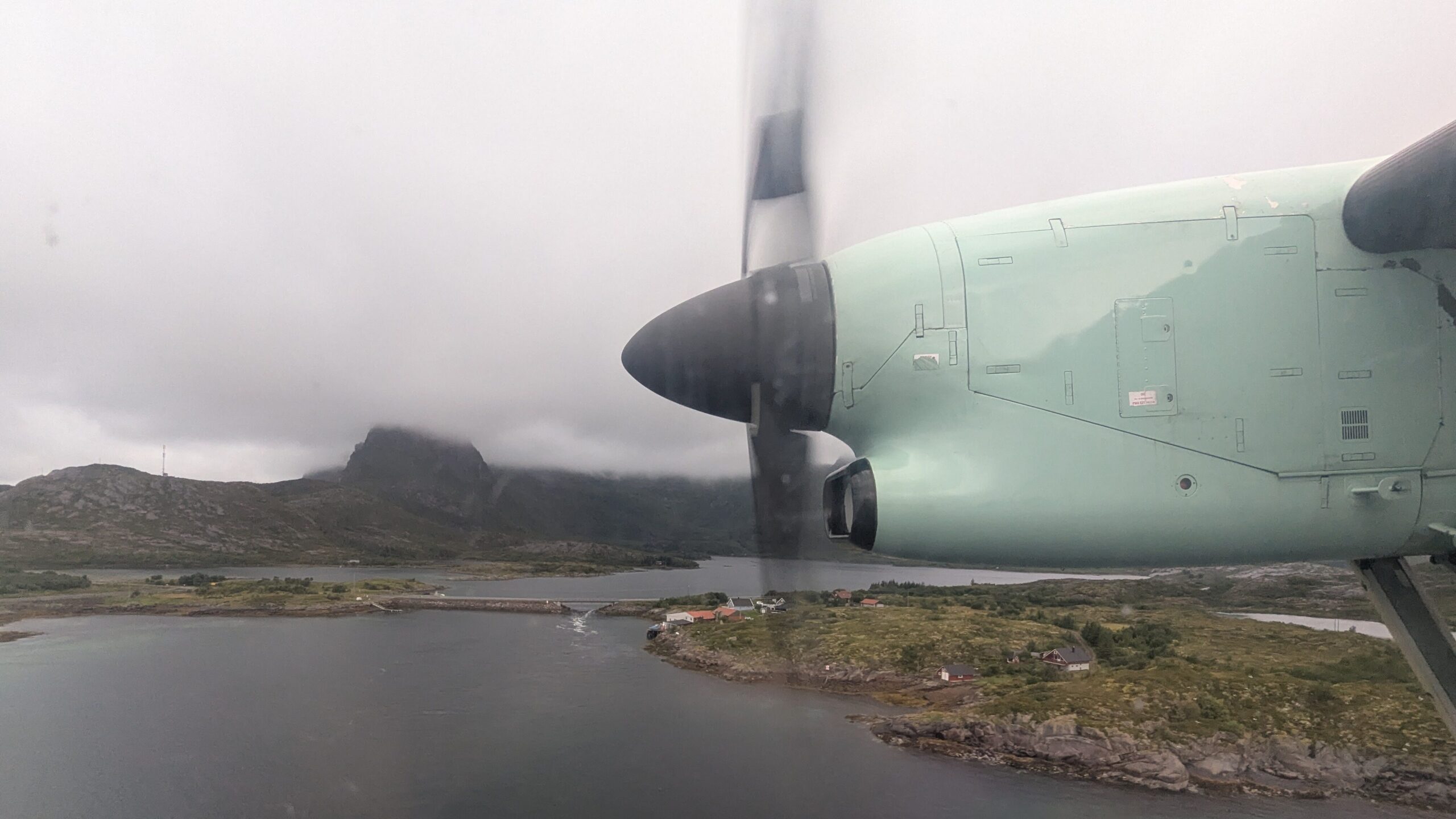 Flying by propeller plane from Bodo to Svolvær. Lofoten.