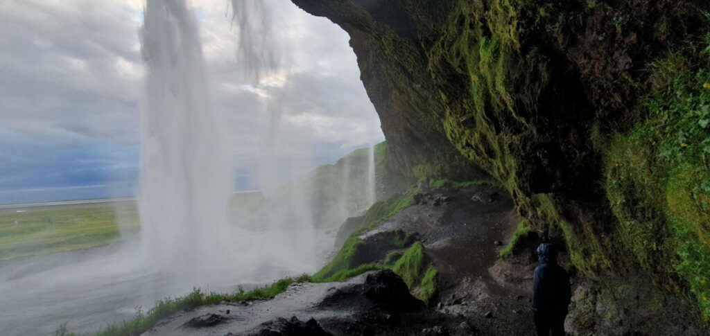 View from behind Seljalandsfoss waterfall on Iceland's South Coast.